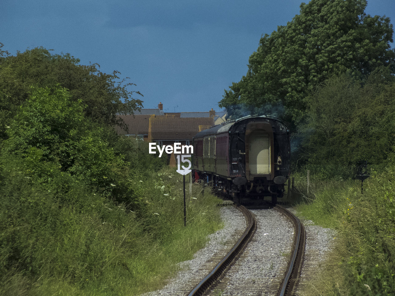 Train on railroad track against sky