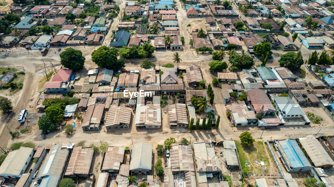residential area, neighbourhood, bird's-eye view, suburb, aerial photography, architecture, town, high angle view, city, building exterior, built structure, building, residential district, urban area, aerial view, cityscape, metropolitan area, roof, urban design, house, day, tower block, no people, downtown, town square, transportation, street, estate, outdoors, nature, community, landscape, tree, road, mode of transportation, motor vehicle, car, environment, plant, village, full frame