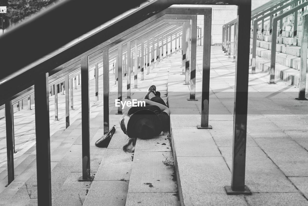 Woman lying on steps