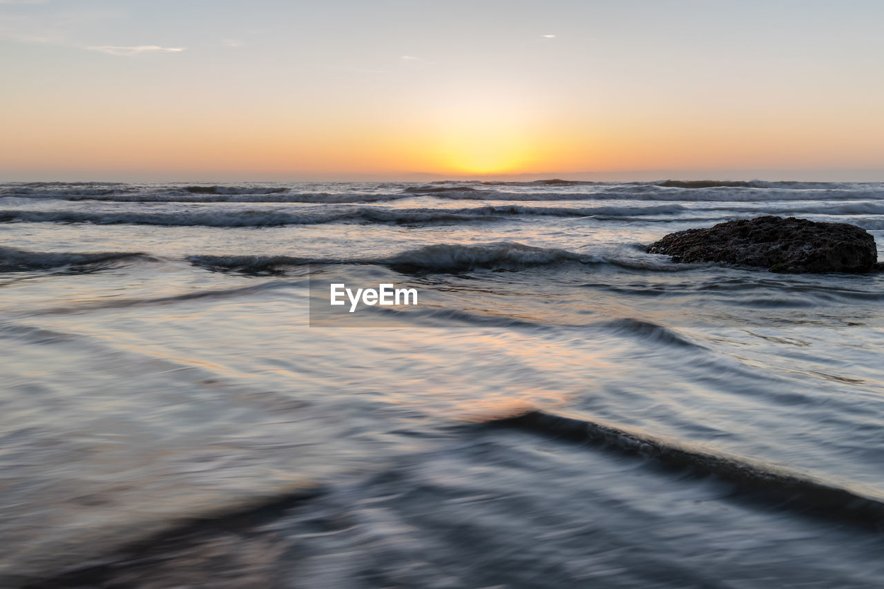 VIEW OF SEA AT SUNSET