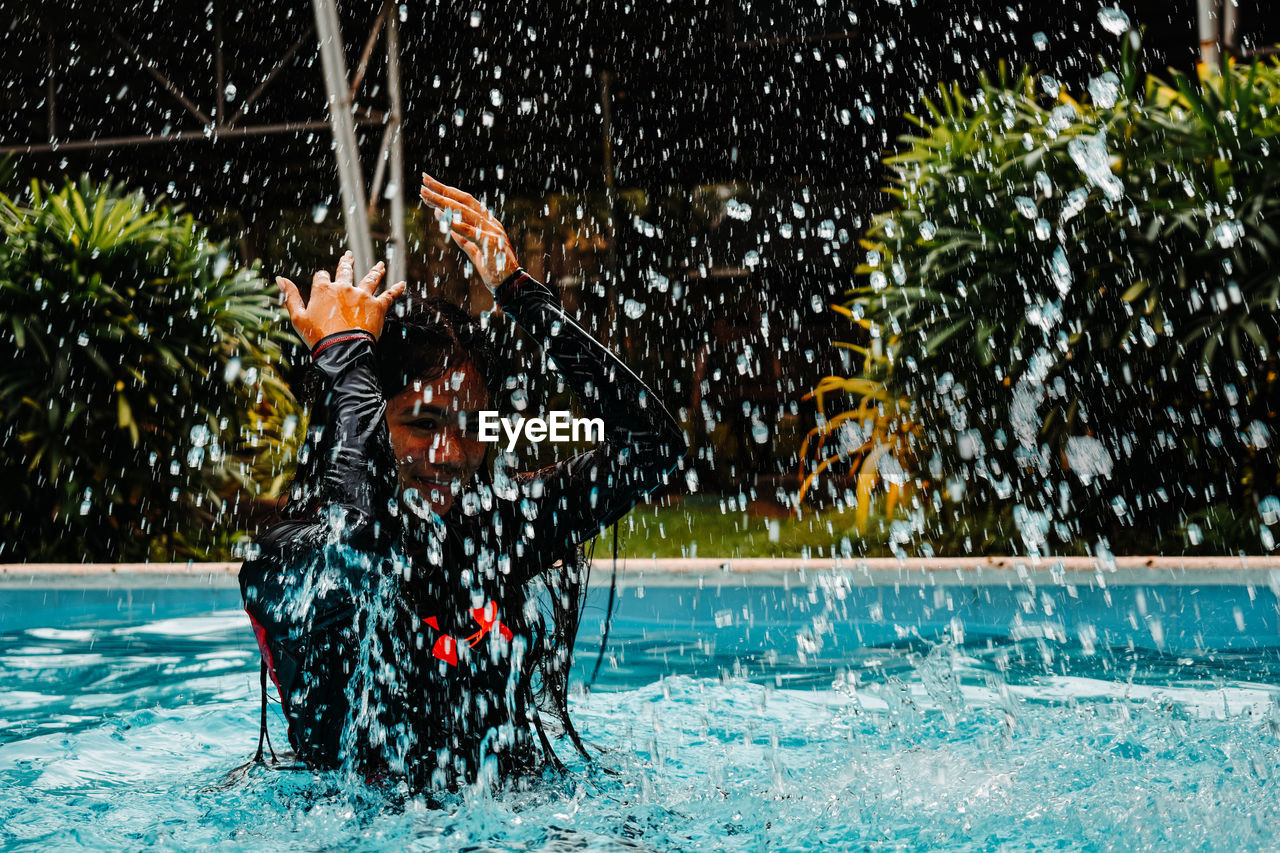 View of woman swimming in pool