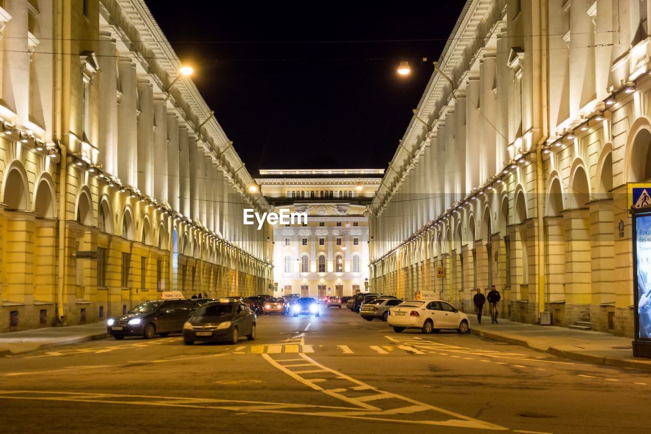 CARS ON STREET AT NIGHT