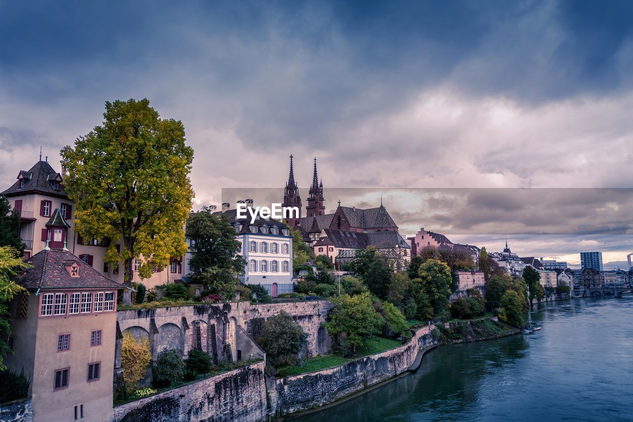 View of old buildings against cloudy sky