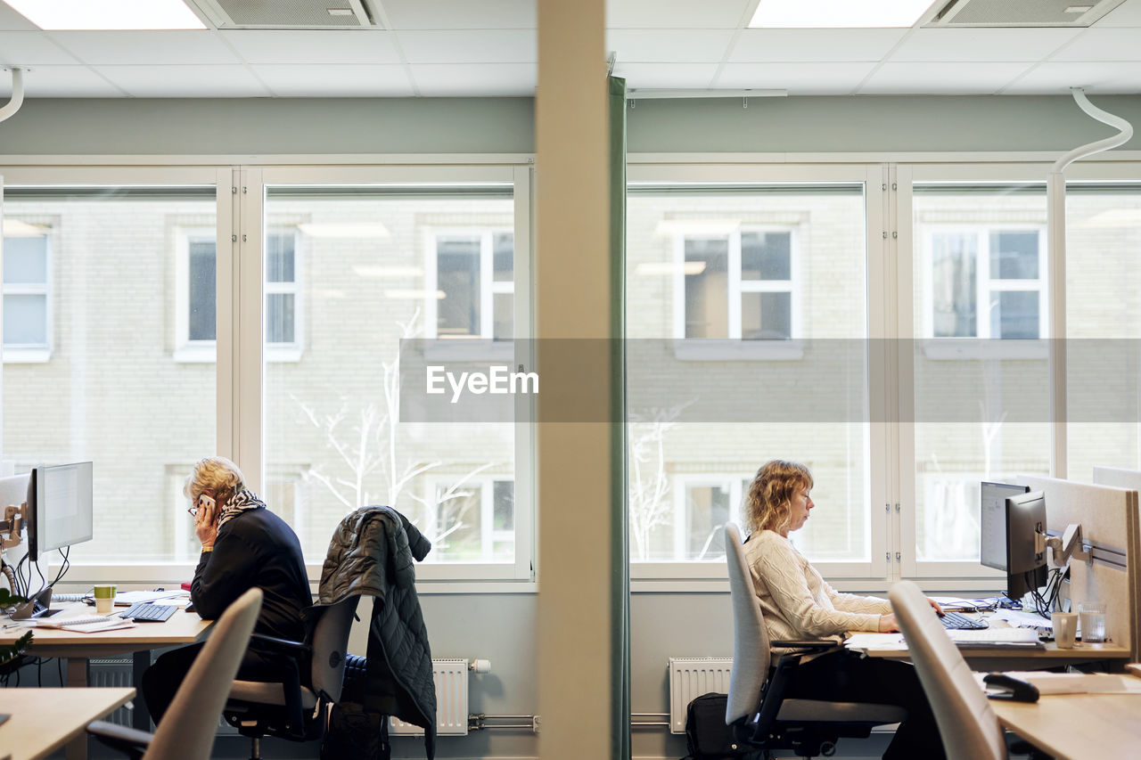 Women working at desks in office