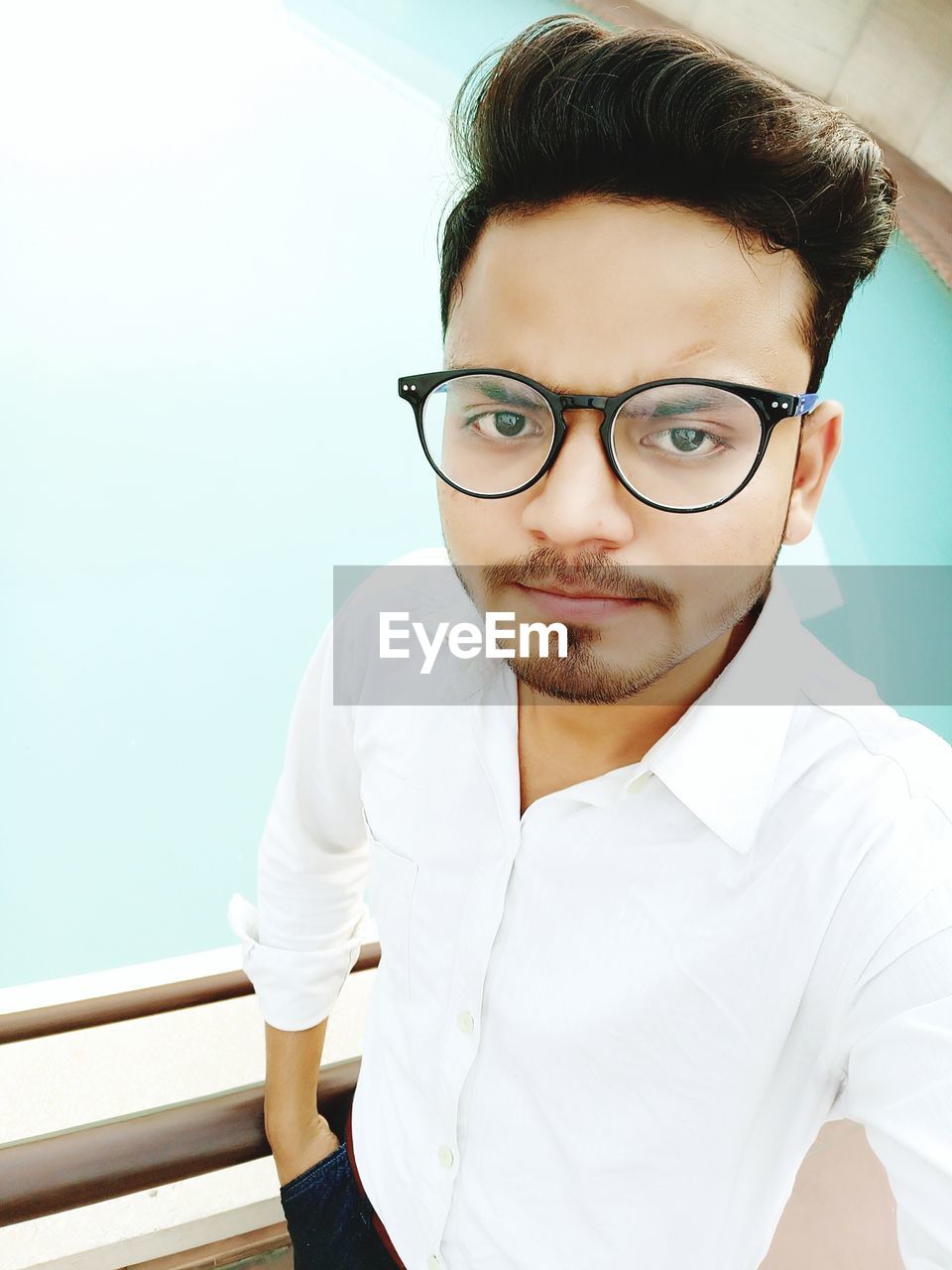 Portrait of young man wearing eyeglasses