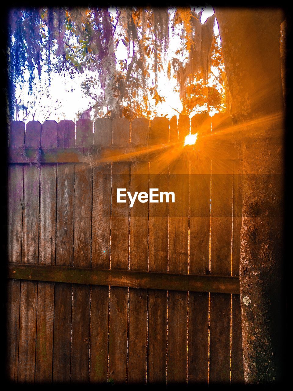 CLOSE-UP OF WINDOW AGAINST SKY DURING SUNSET