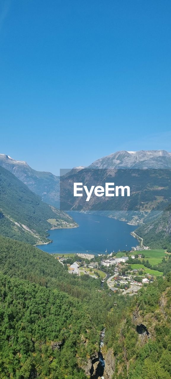 SCENIC VIEW OF MOUNTAINS AGAINST BLUE SKY