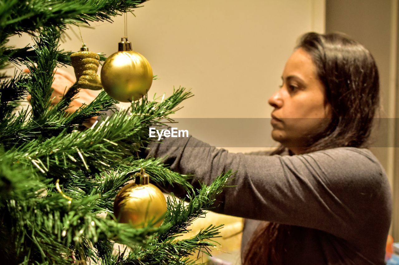 Woman on christmas tree