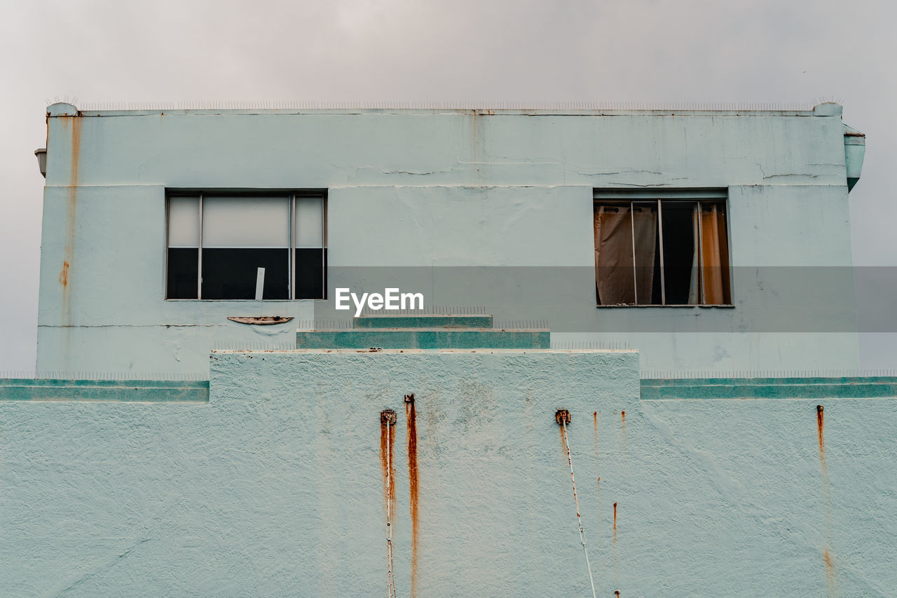 Building facade with two open windows