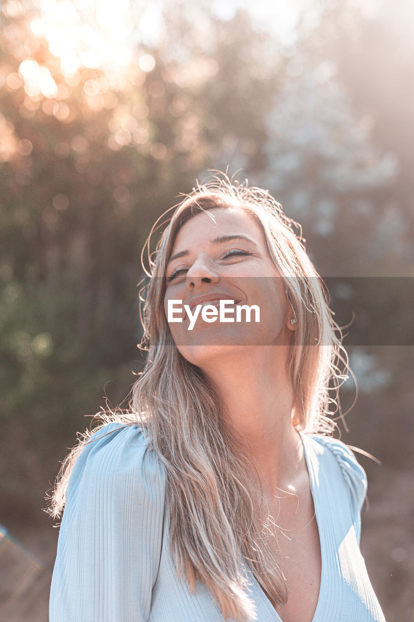 Portrait of smiling woman outdoors