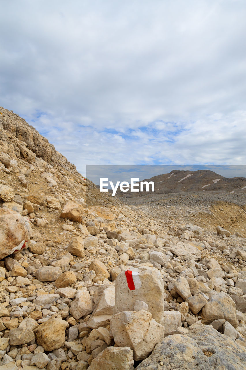 SCENIC VIEW OF ROCKS AGAINST SKY