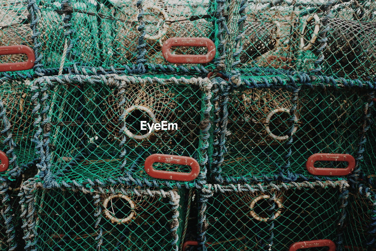 Full frame shot of stacked lobster traps at harbor