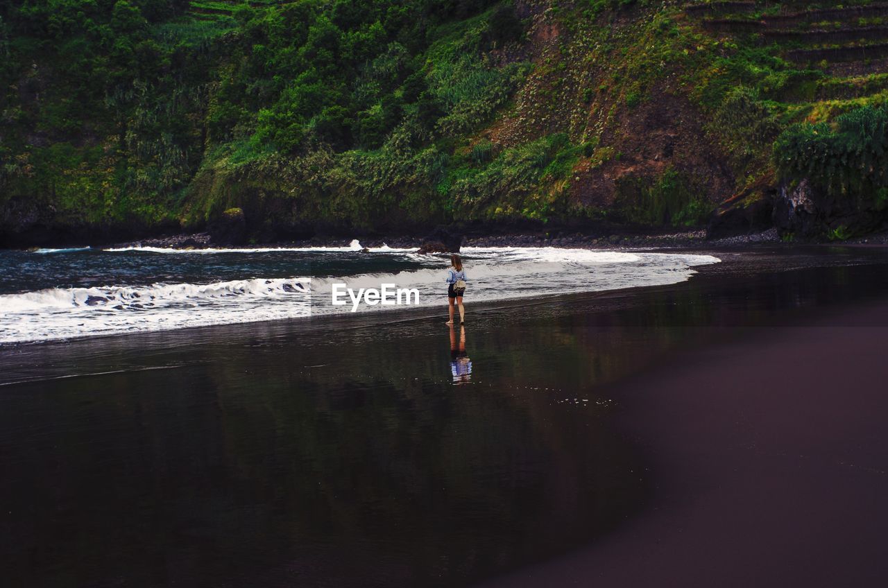 Woman walking at beach