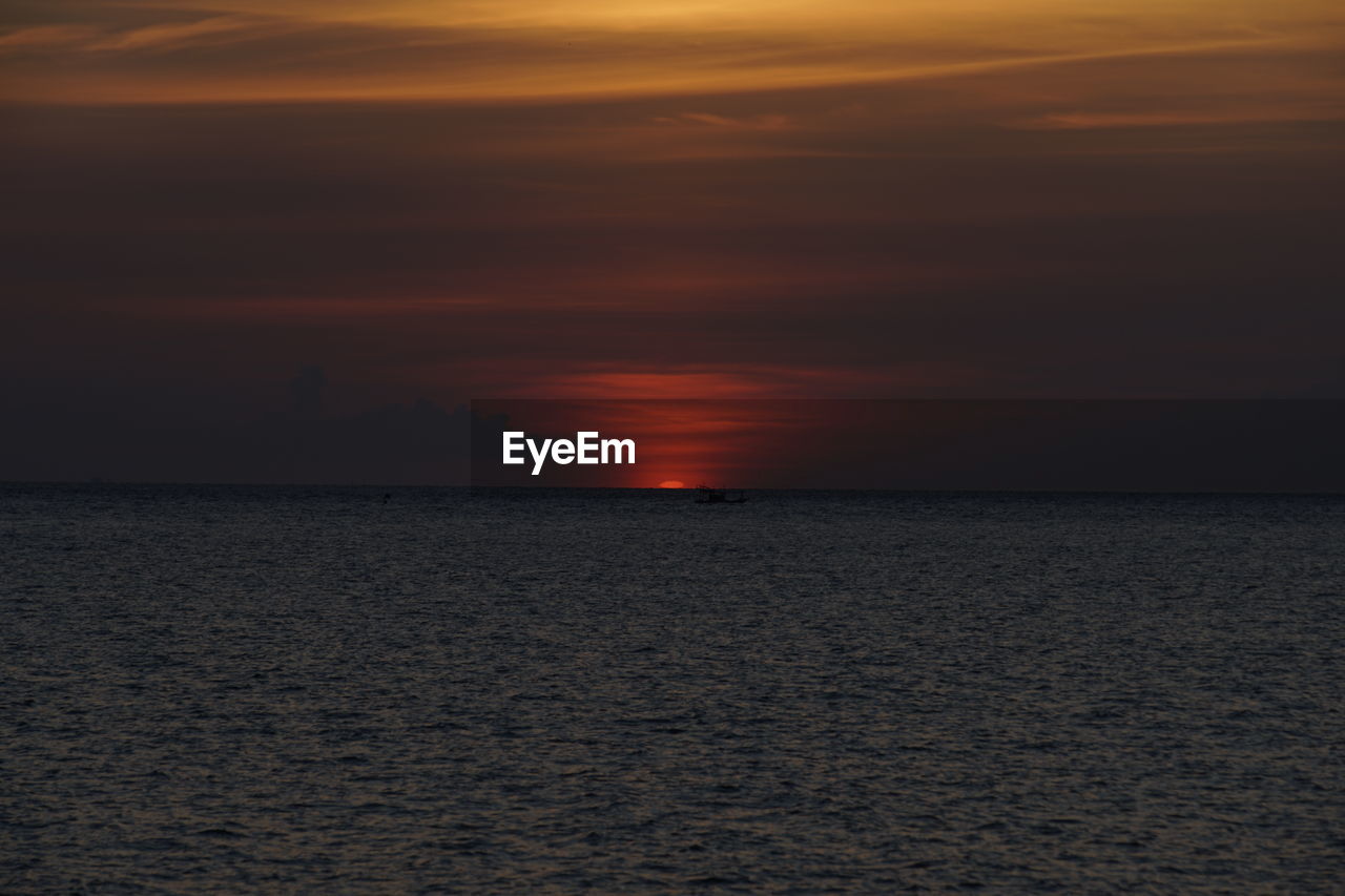 SCENIC VIEW OF SEA DURING SUNSET