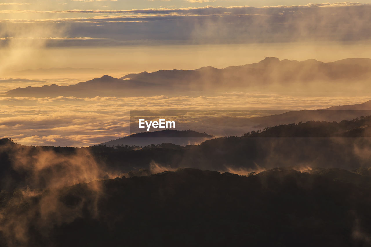 Scenic view of mountains against sky during sunset