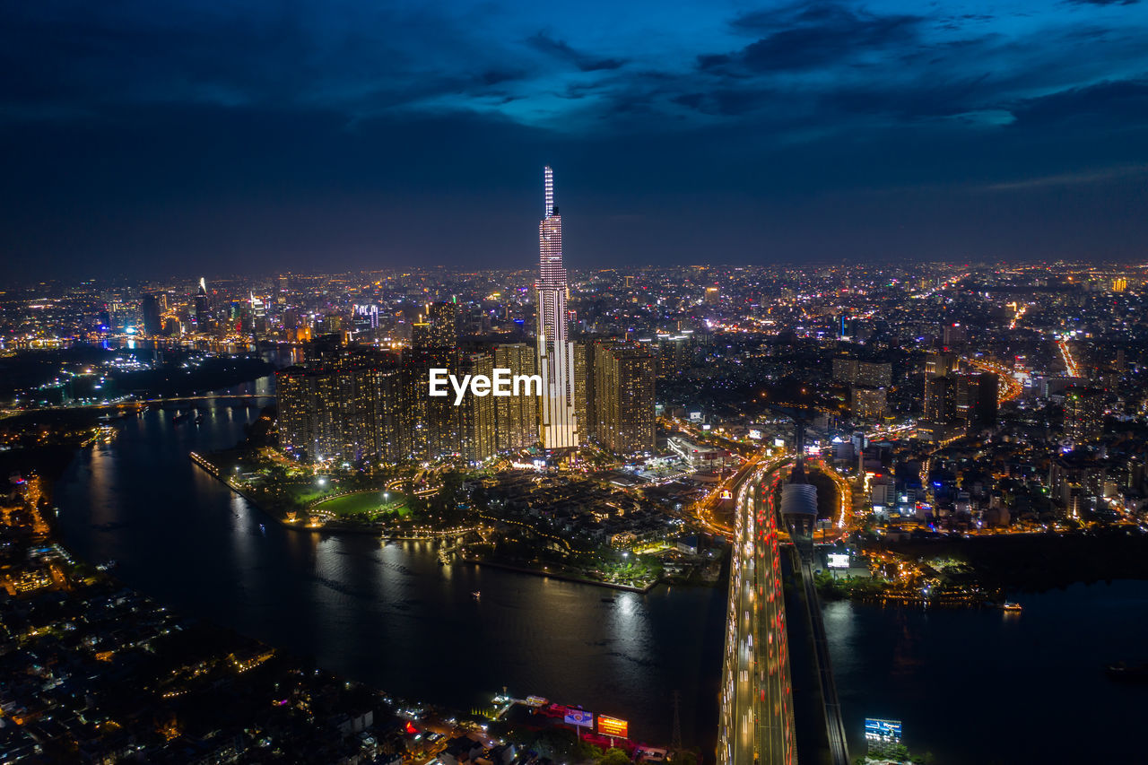 Top view aerial of center ho chi minh city and saigon bridge at sunset