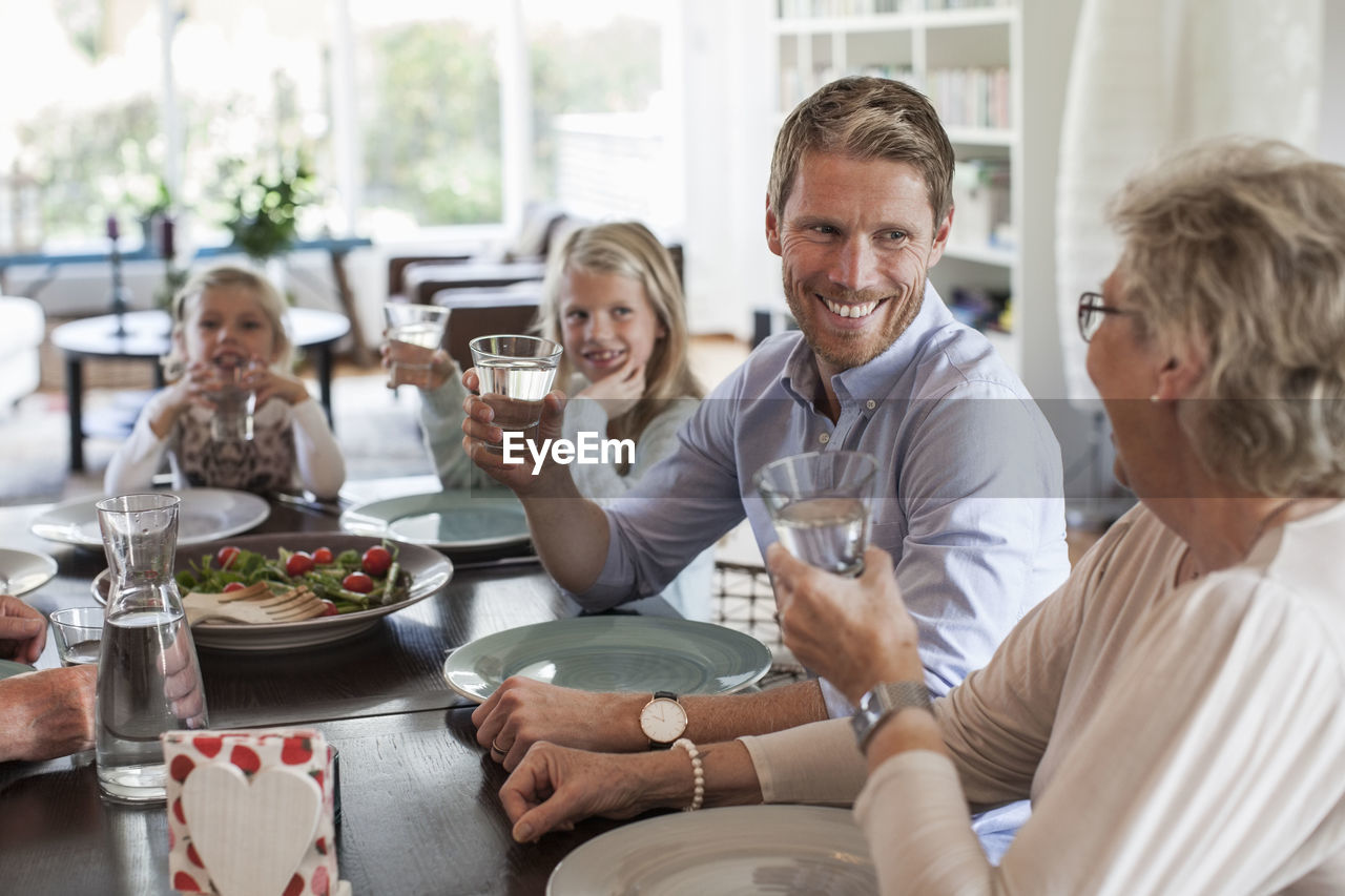 Happy family having lunch together at home