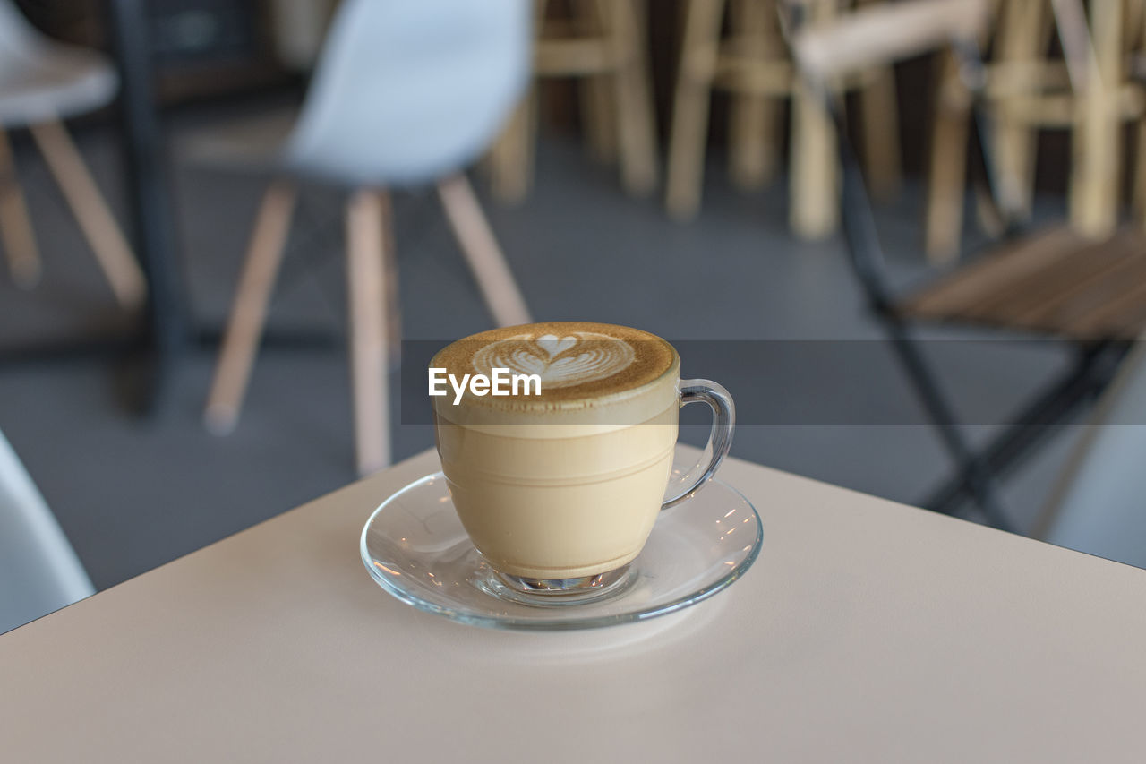 Close-up of cappuccino on table