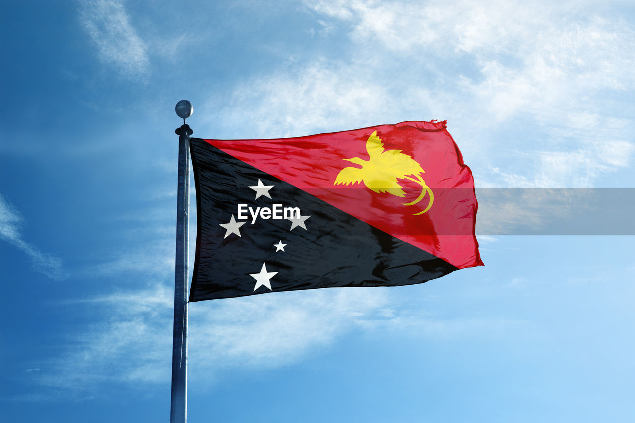 LOW ANGLE VIEW OF FLAGS FLAG AGAINST SKY