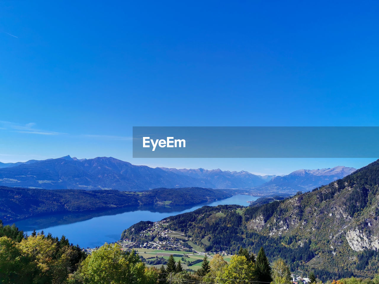 PANORAMIC VIEW OF MOUNTAINS AGAINST BLUE SKY