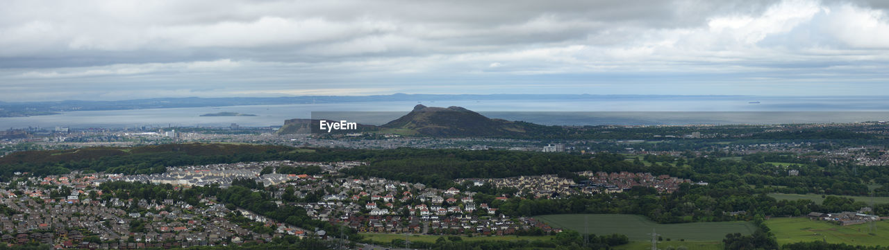 Panoramic shot of cityscape against sky