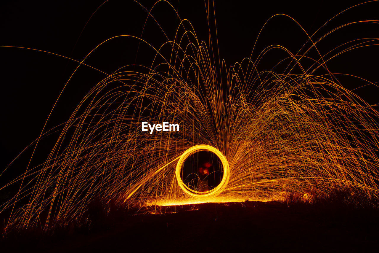 LIGHT TRAILS AT NIGHT DURING DUSK