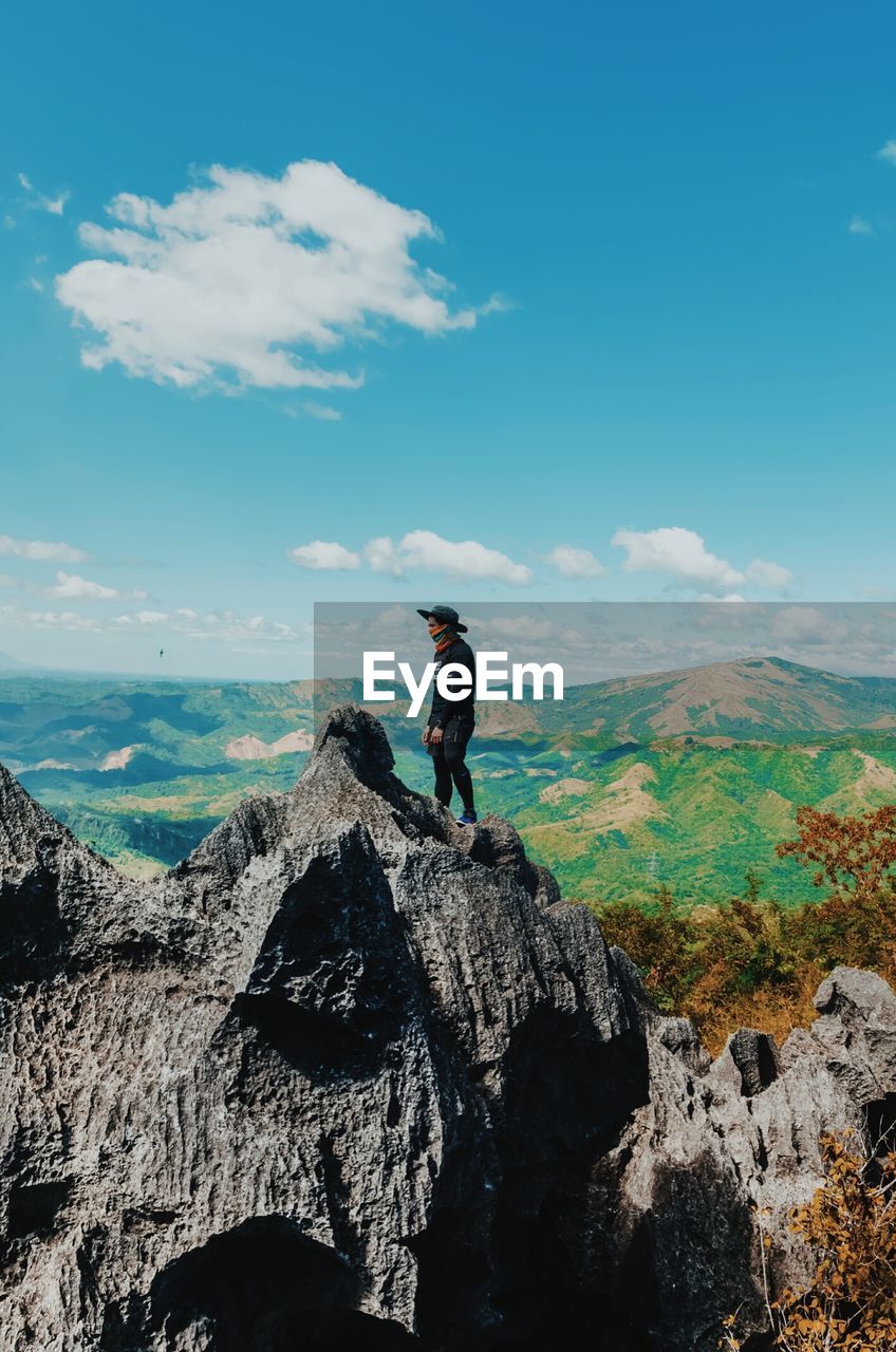 Woman standing on rock