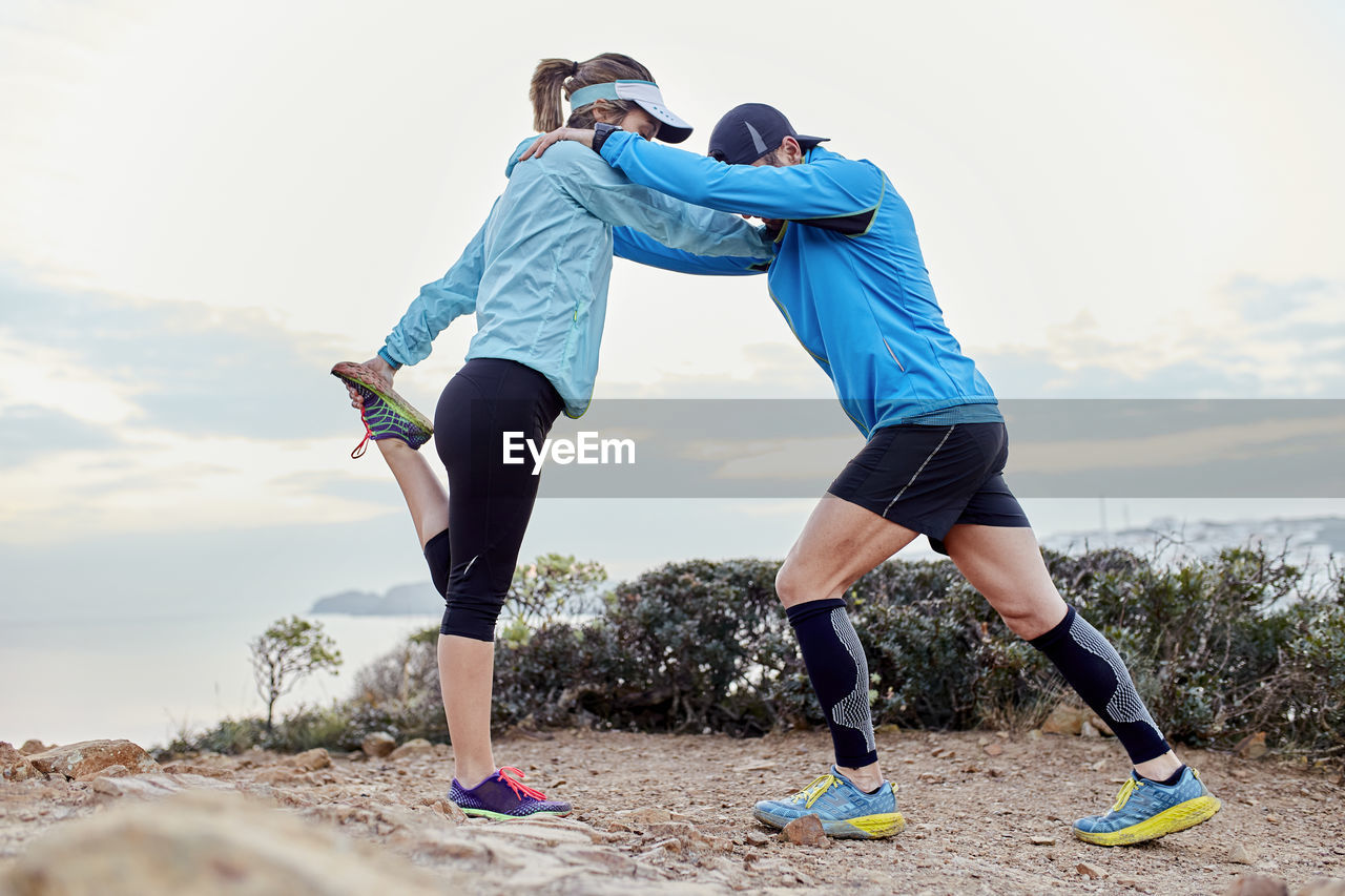 Couple doing warm up exercise together