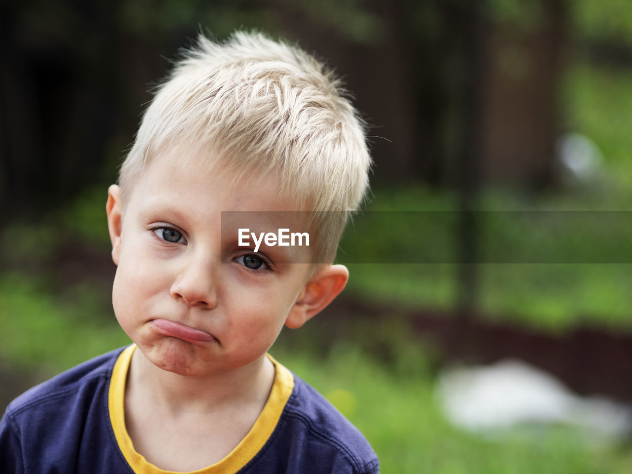 Close-up portrait of boy making face