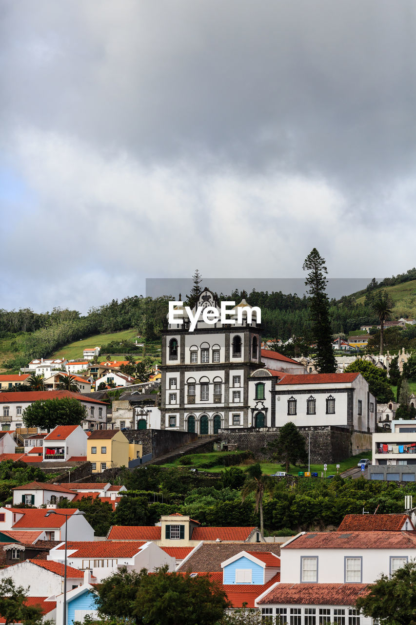 Houses and buildings against sky