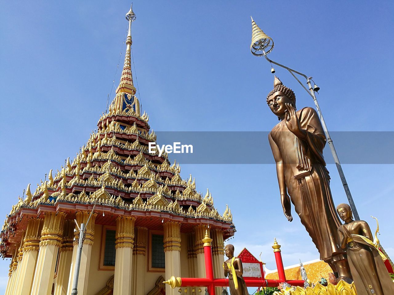 Low angle view of statue against temple