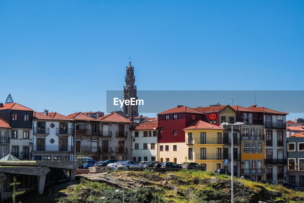 BUILDINGS AGAINST BLUE SKY