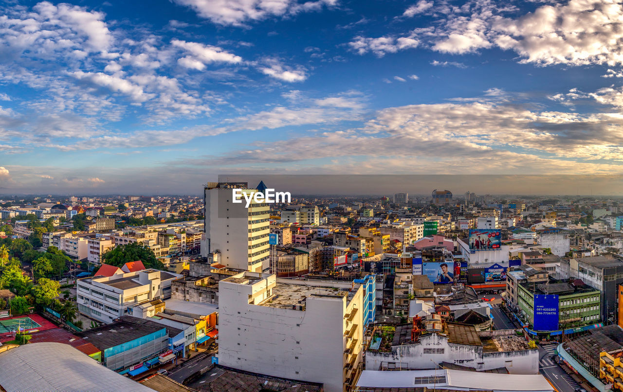 High angle view of city buildings against sky