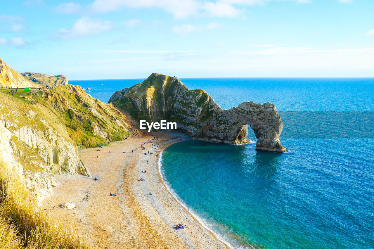 Scenic view of sea against cloudy sky