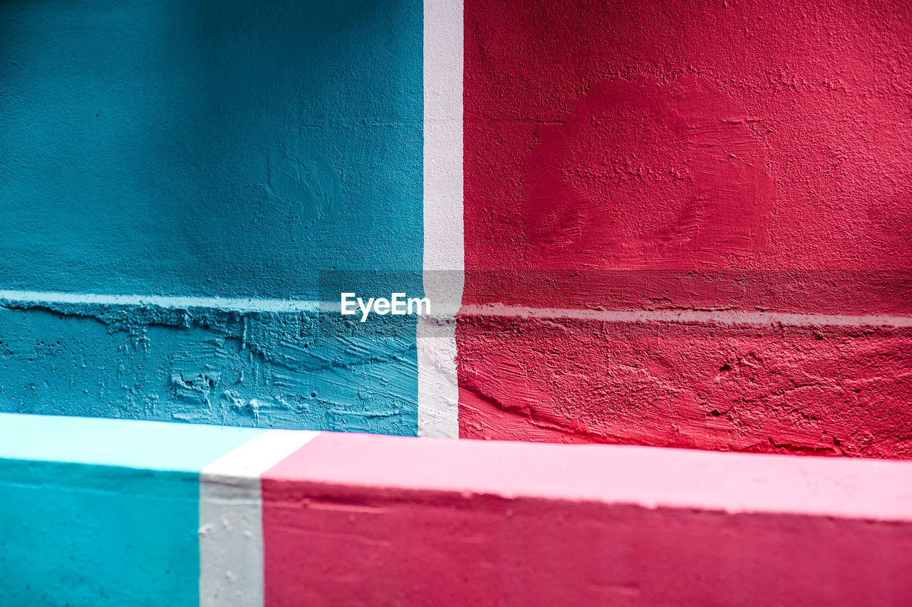 Full frame shot of painted blue and red wall