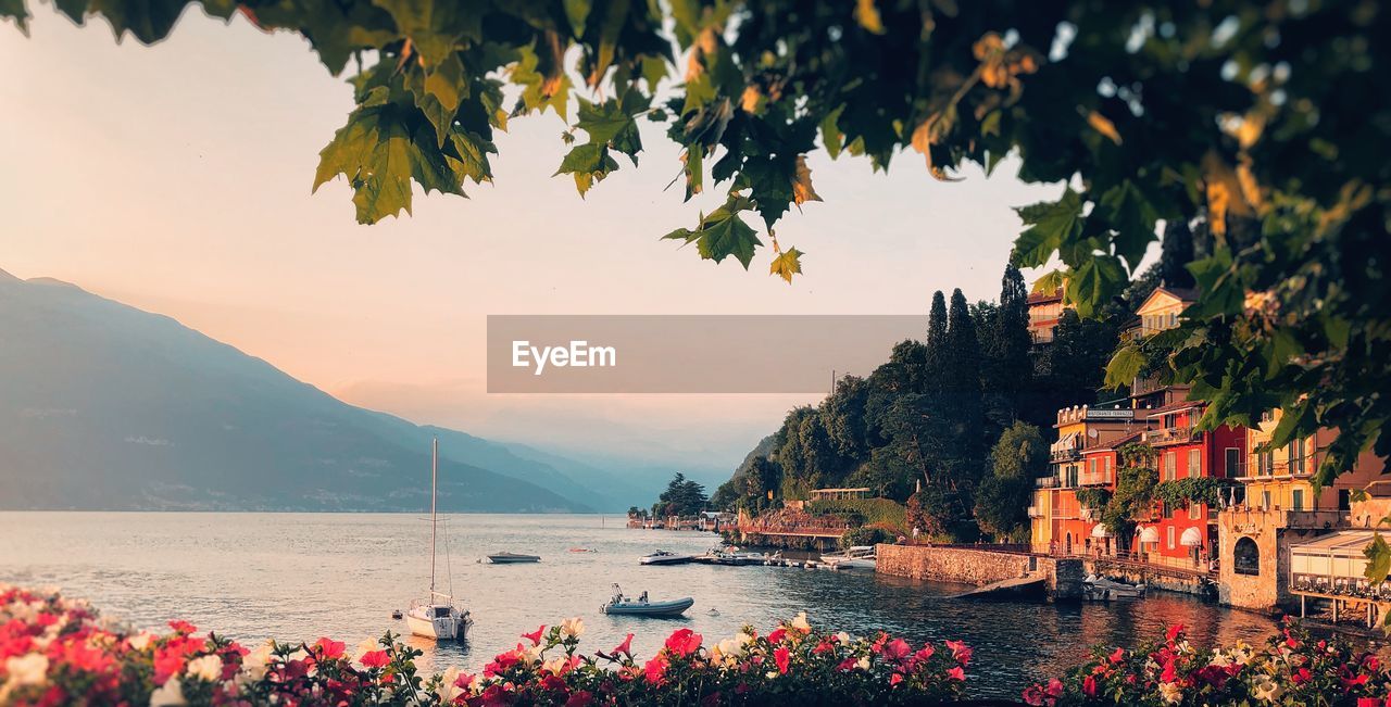 Scenic view of sea and mountains against sky