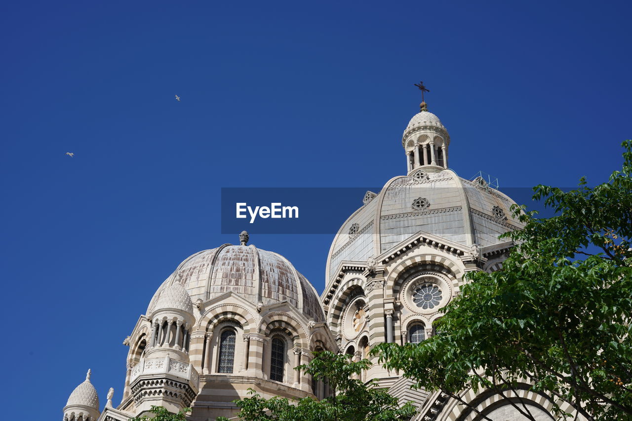 Low angle view of a building against blue sky