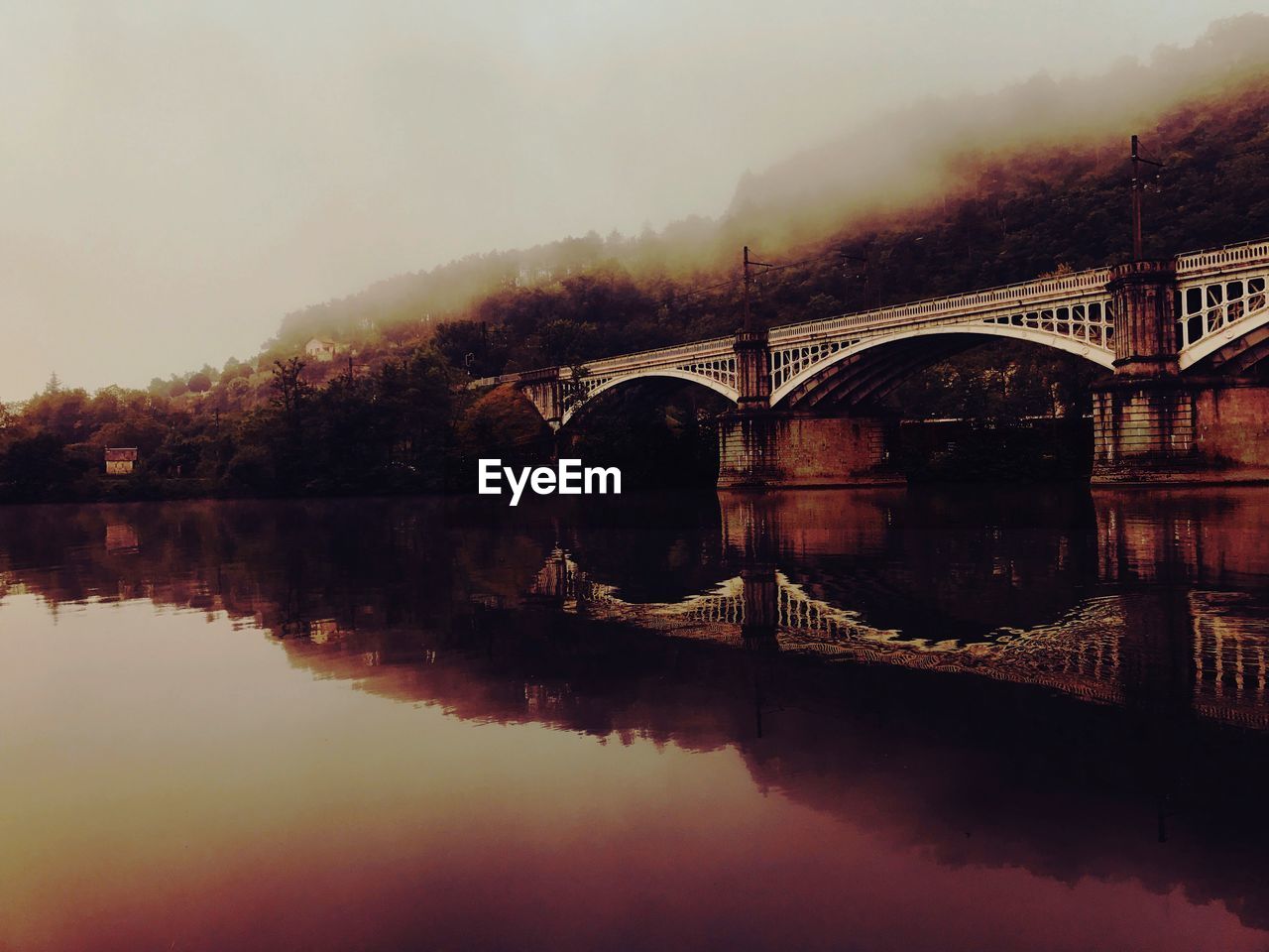 Bridge over river against sky