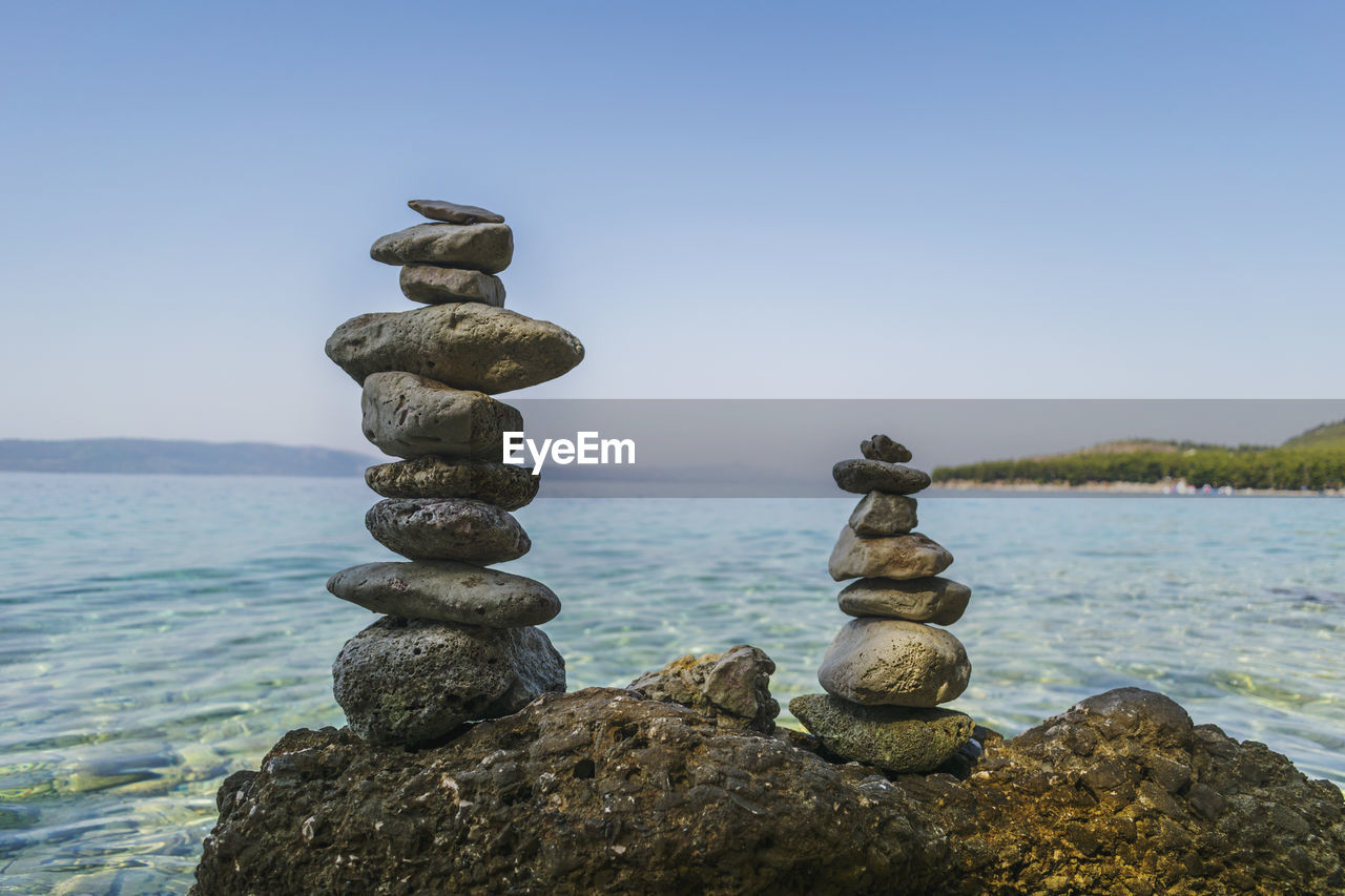 STACK OF ROCKS AGAINST SEA