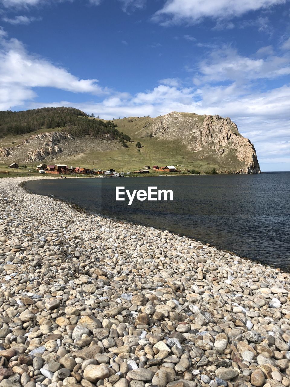 STONES ON SHORE AGAINST SKY