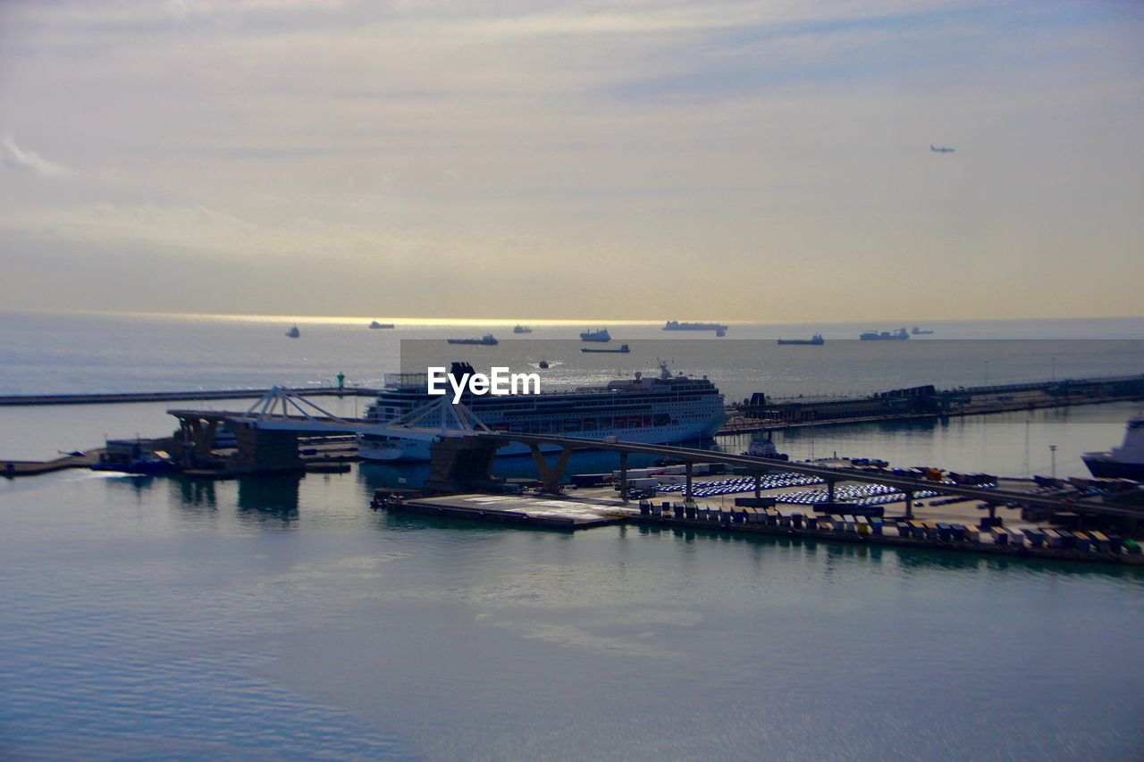 Boats moored in sea against sky