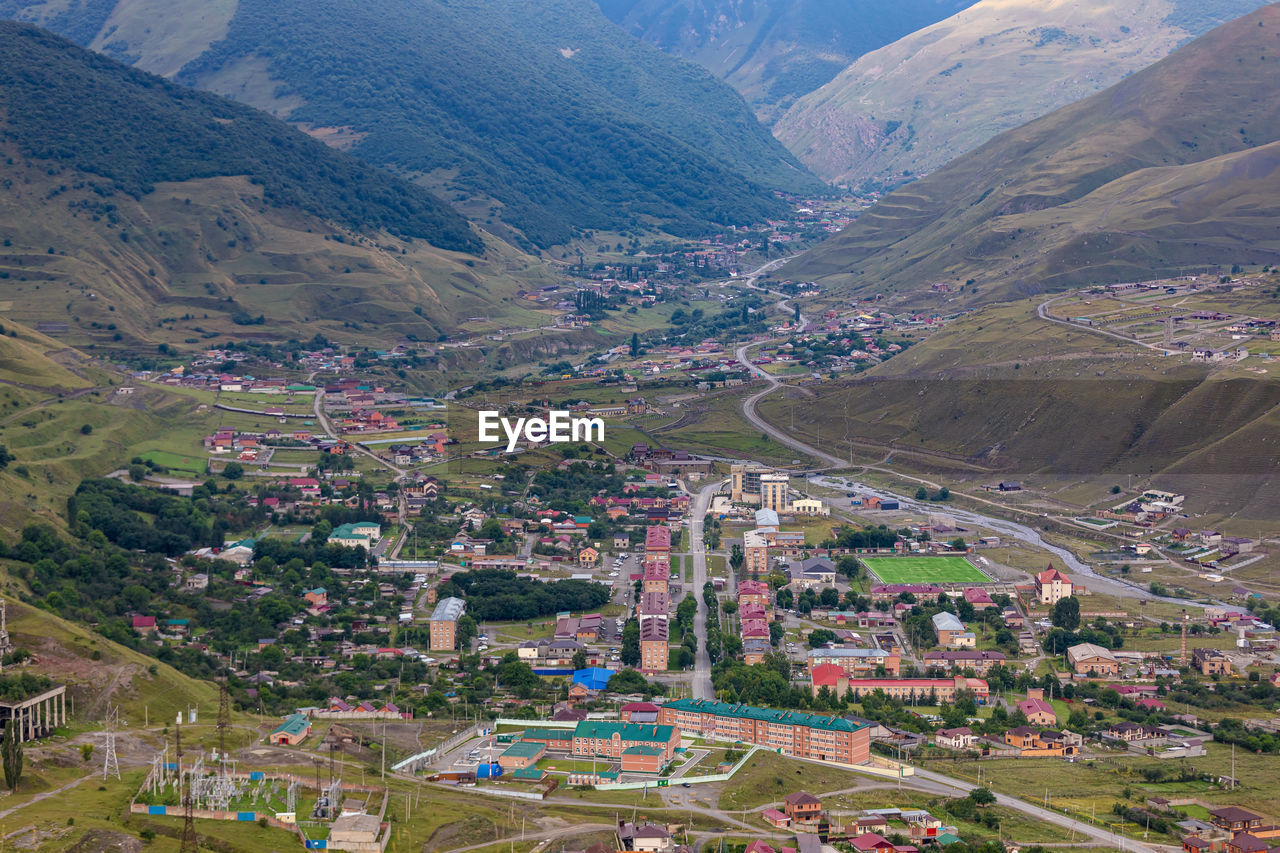 Mountain landscape with a city at the bottom of the gorge. upper fiagdon in north ossetia