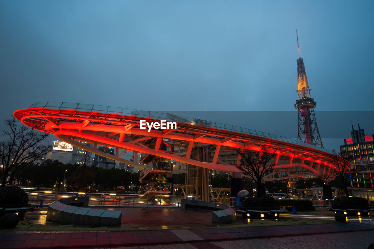 VIEW OF BUILDING AGAINST CLOUDY SKY