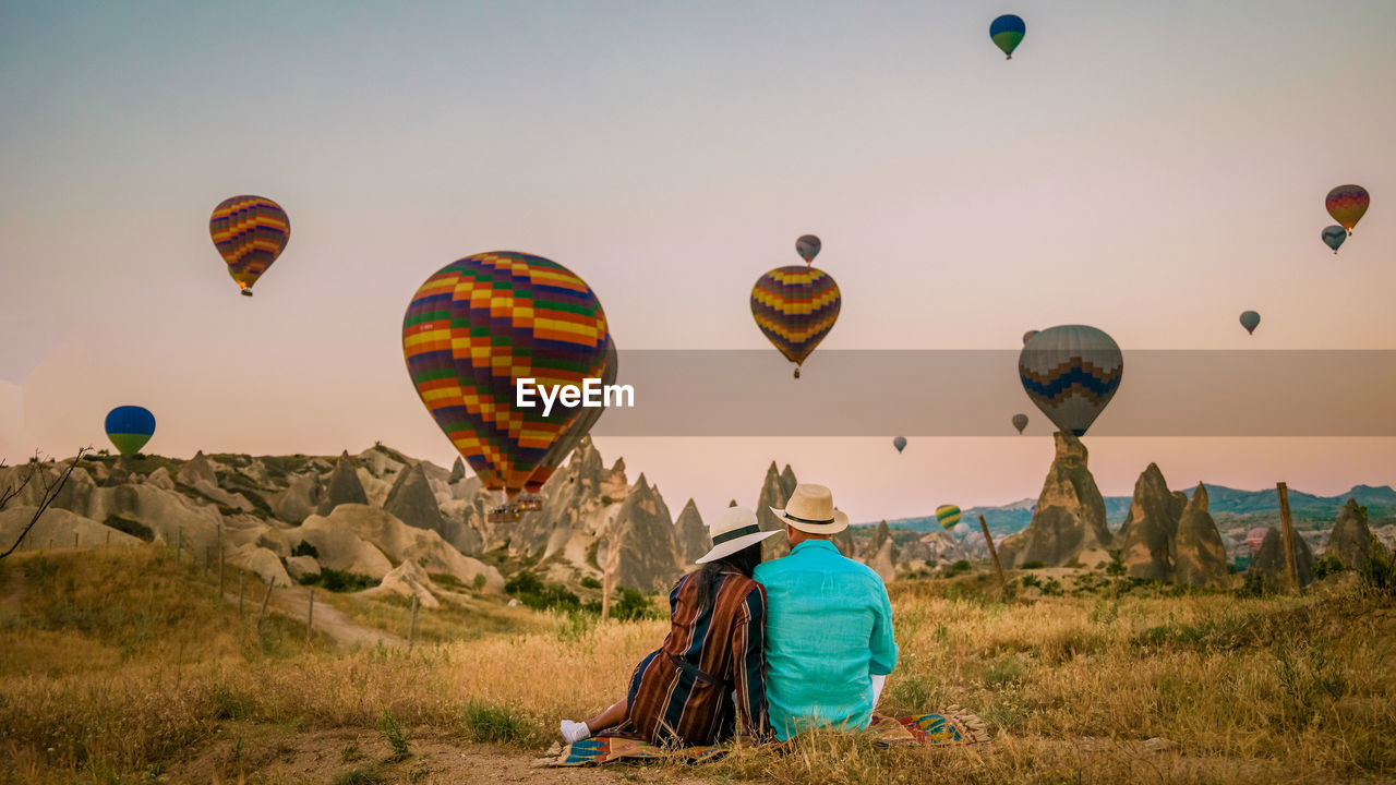 low angle view of hot air balloons on field