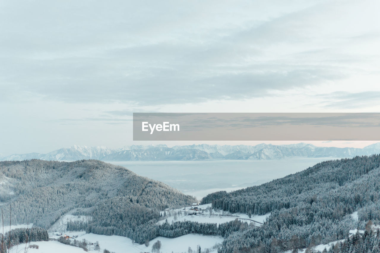 Scenic view of snowcapped mountains against sky