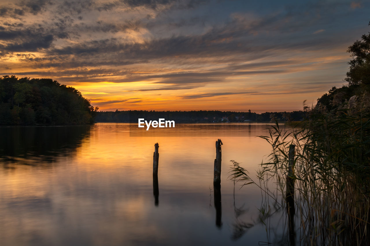 Scenic view of lake against sky during sunset