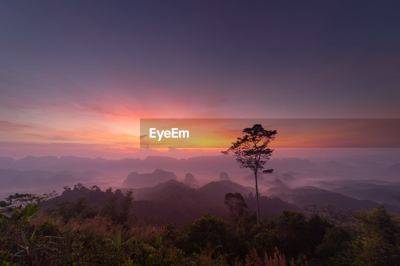 Scenic view of mountains against sky during sunset