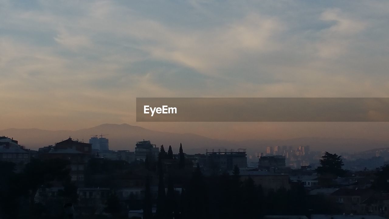 Cityscape against sky during sunset