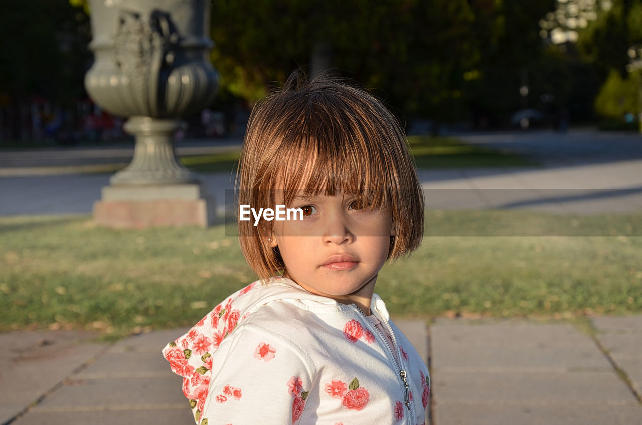 Portrait of little blond girl looking towards the camera