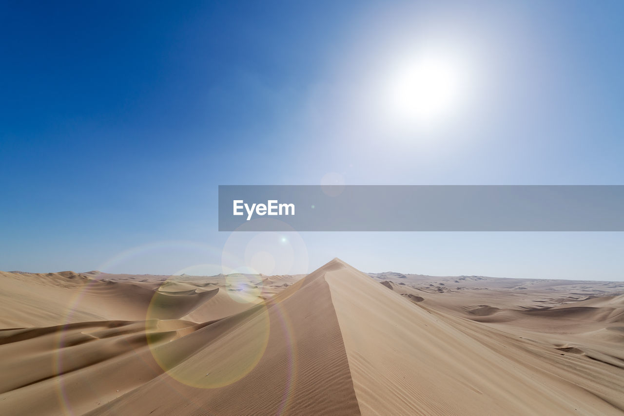 Scenic view of desert against clear sky